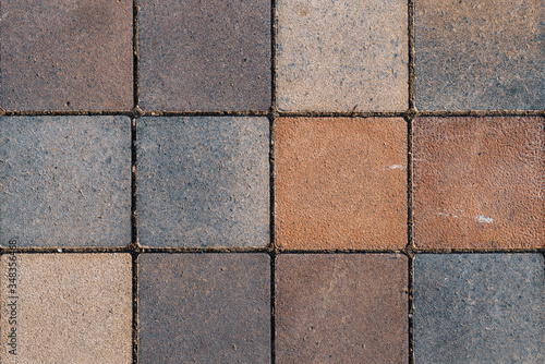 Rustic floor covered with square terracotta tiles