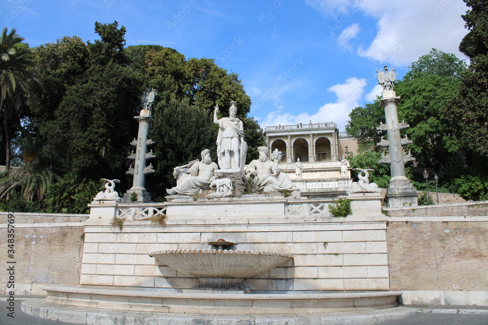 fountain and statures in Piazza del Popolo rome city center italy