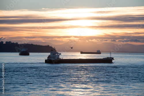 Tanker and Freighter Ships Wait in Burrard Inlet Vancouver, British Columbia to load and unload at the Port of Vancouver © Oliver