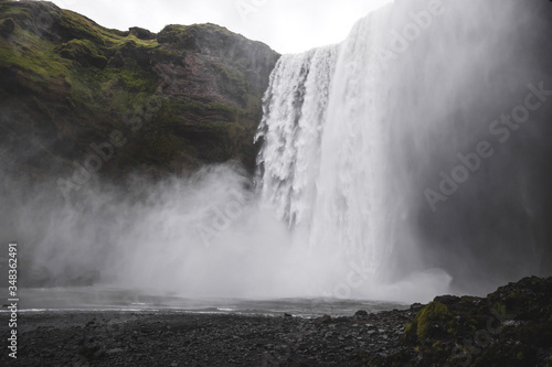 Skogafoss Iceland famous waterfall. Powerful stream, dramatic view with nobody. Icelandic golden circle landmark.
