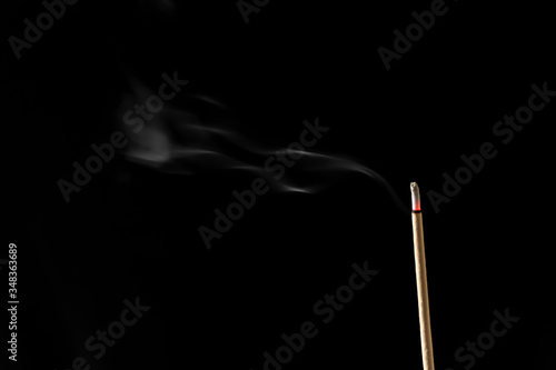 Incense sticks and incense stick smoke on black backgrond
