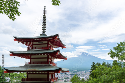 Beautiful Japanese Pagoda with Mount Fuji in the background during summer with cloudy skies