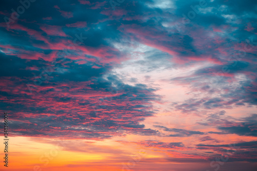 Orange sunset with blue and purple clouds © Prostock-studio