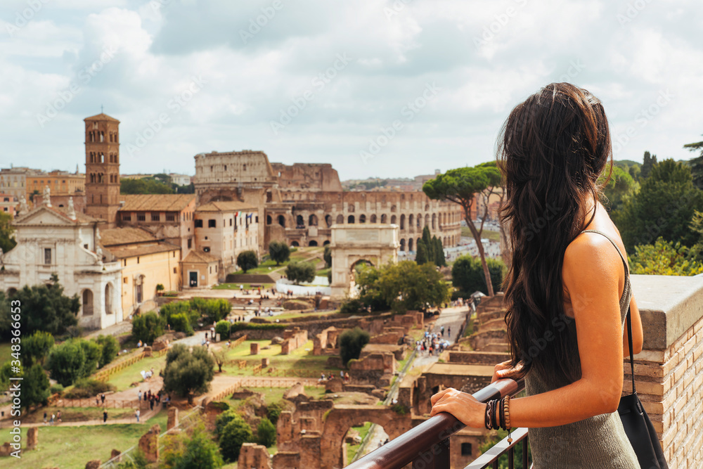 Young woman looking roman forum from Palatino Mount