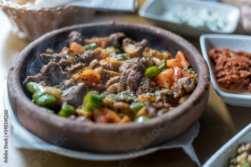 Beef meat with vegetables in casserole stew - Turkish delicious güveç