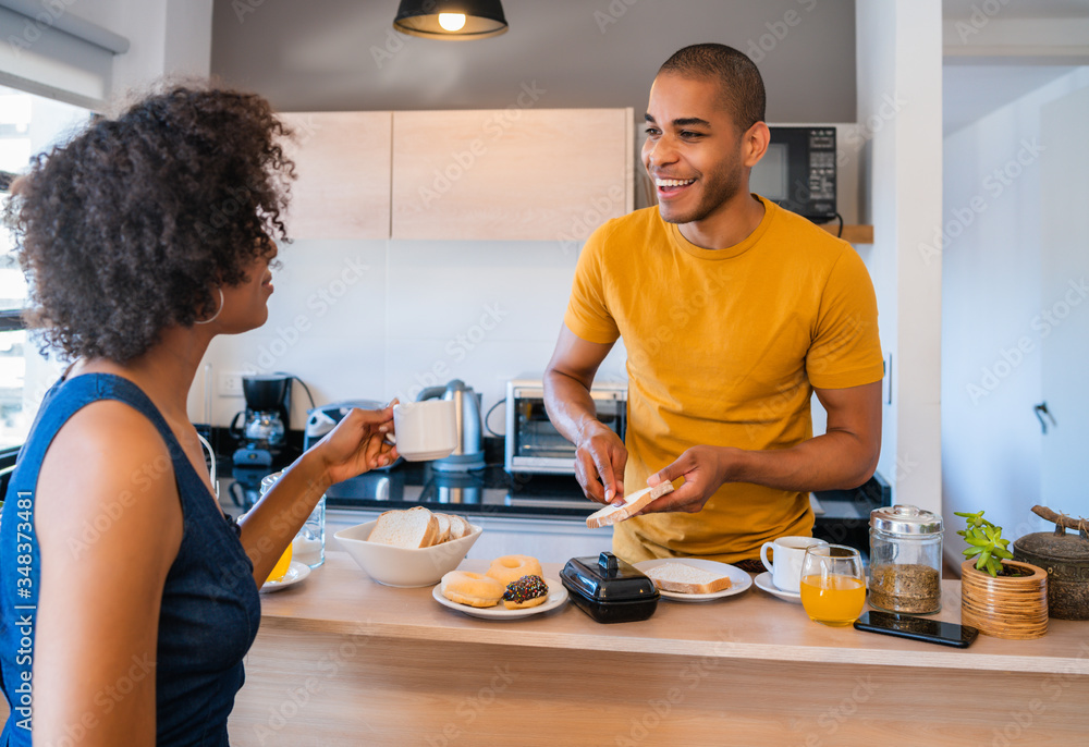 Quarantined couple having breakfast together. Stay at home. Quarantined couple having breakfast together. Stay at home.