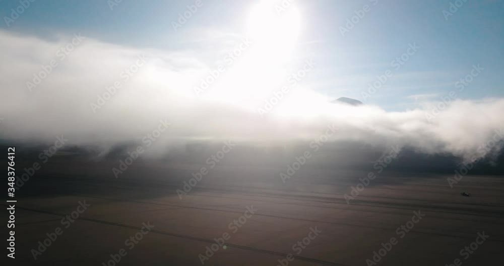Salvador dalí desert, seen with a drone between the blue sky and clouds in Bolivia and the Andes mountain range Salvador dalí desert, seen with a drone between the blue sky and clouds in Bolivia and the Andes mountain range