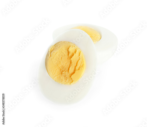 Halves of fresh hard boiled chicken egg isolated on white