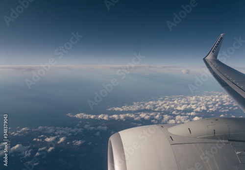 Ryanair flying and traveling, view from airplane window on the wing.