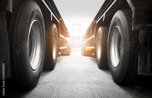 Semi Trailer Trucks on Parking  at Warehouse. Big Rig Semi Truck Wheels Tires. Auto Service Shop. Shipping Trucks. Lorry Tractor. Industry Freight Truck Logistics Cargo Transport.	