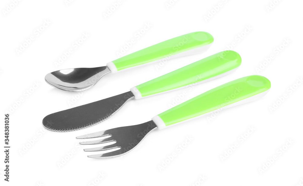 Set of small cutlery isolated on white. Serving baby food Set of small cutlery isolated on white. Serving baby food