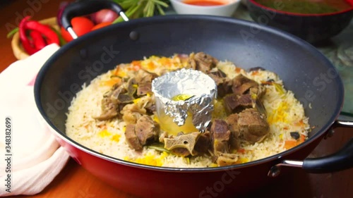 lamb stew with rice in the pan photo