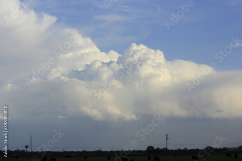 Cumulonimbus clouds with blue sky out in the country.