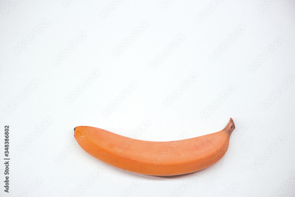 Single red banana against white background copy space Single red banana against white background copy space