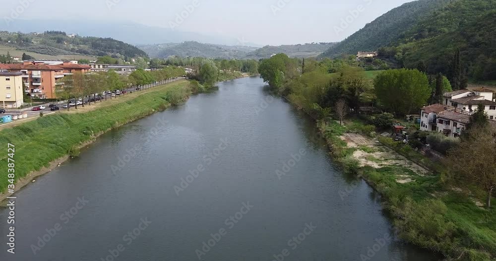 Riverside flying cinematic in Sunset drone above the Arno river vineyard. Sieci small town near Pontassieve Florence, in the Tuscany region of Italy. December 2019. Riverside flying cinematic in Sunset drone above the Arno river vineyard. Sieci small town near Pontassieve Florence, in the Tuscany region of Italy. December 2019.