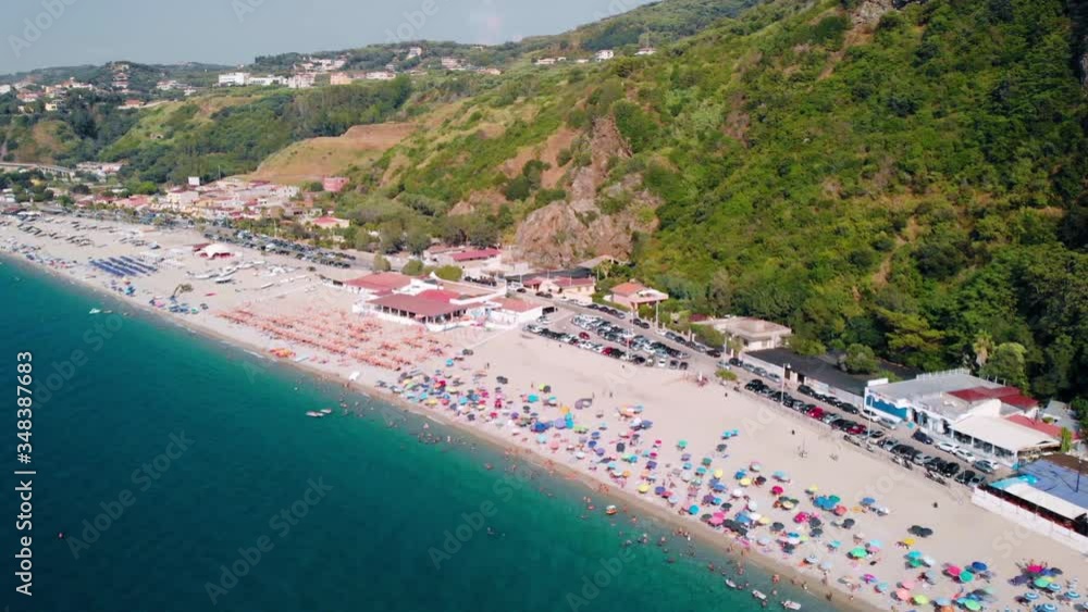 Aerial, pull back, drone shot away from the Palmi Beach, sunny day, Calabria, Italy Aerial, pull back, drone shot away from the Palmi Beach, sunny day, Calabria, Italy