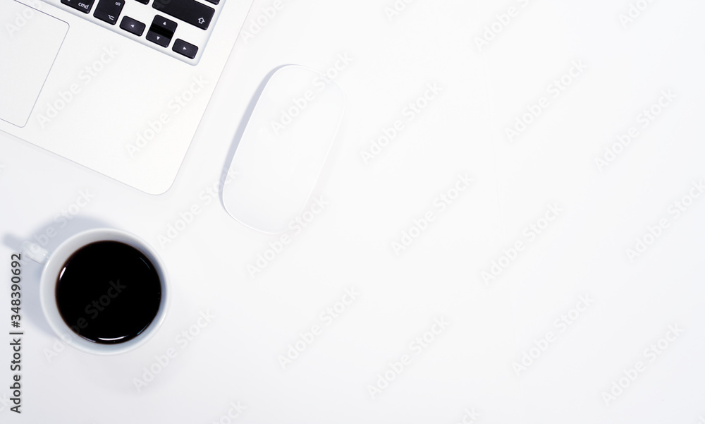 Laptop, mouse and coffee cup on white background, top view, copy space Laptop, mouse and coffee cup on white background, top view, copy space