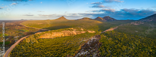 Cape Le Grand National Park in Western Australia - Aerial panorama of some of the granite peaks, hills and bush fire effected area in the national park near the beach camp site near a granite bluff. 