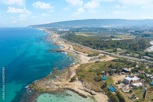 The Israeli coast of the Mediterranean Sea . Near the Banana Beach. Aerial shot in the daytime. 