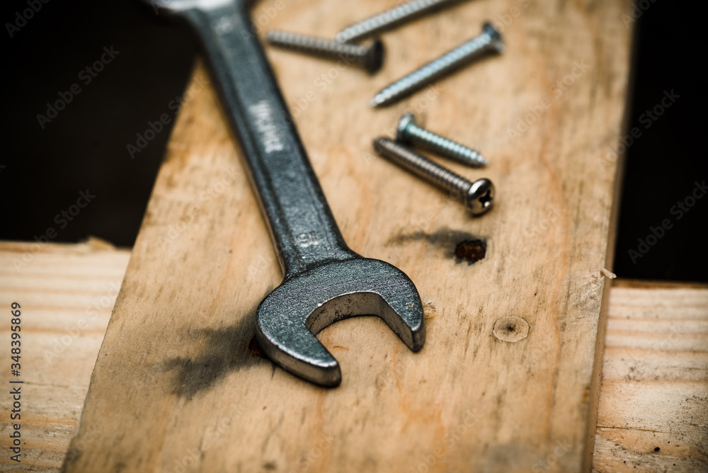 metal wrench on a wooden pallet metal wrench on a wooden pallet