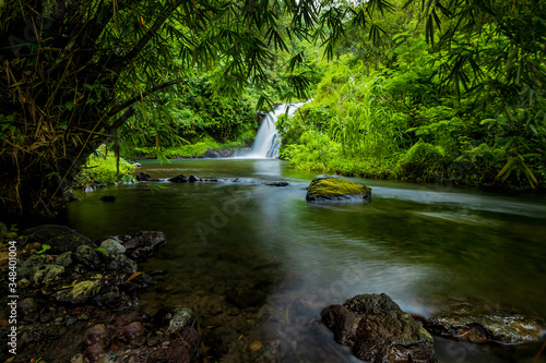 Waterfall landscape. Beautiful hidden Canging waterfall in tropical jungle in Sambangan, Bali. Slow shutter speed, motion photography.