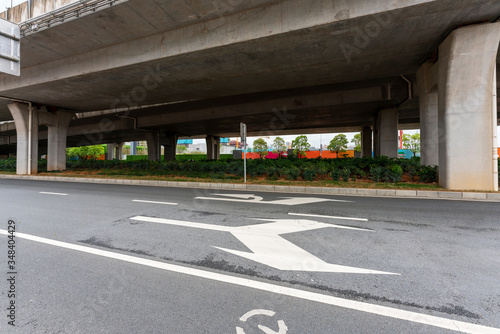 Concrete structure and asphalt road space under the overpass in the city © gjp311