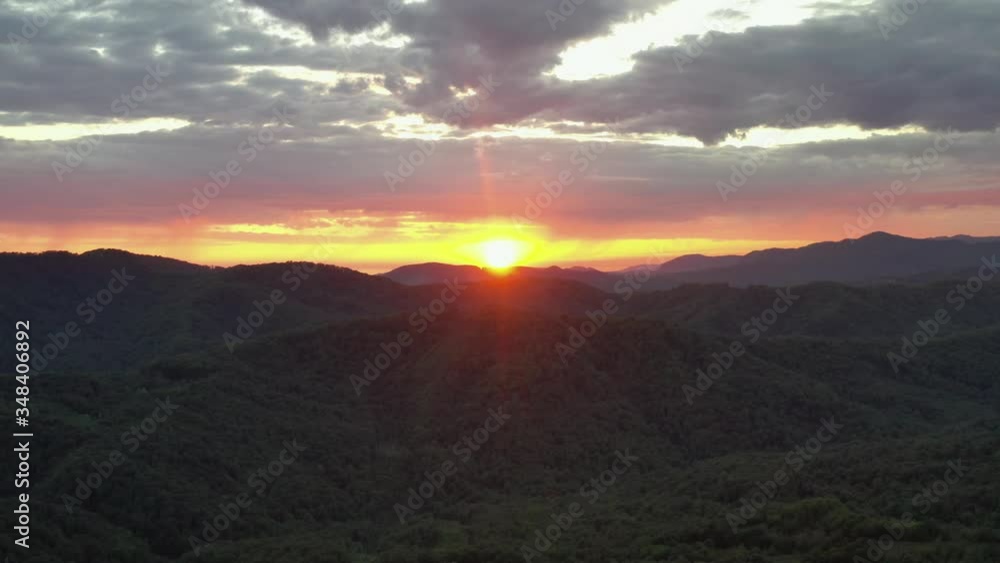 A beautiful sunset over the mountains. Aerial photography. Video. Landscape. Evening. Calm. Peace. Cloudy weather. A beautiful sunset over the mountains. Aerial photography. Video. Landscape. Evening. Calm. Peace. Cloudy weather.