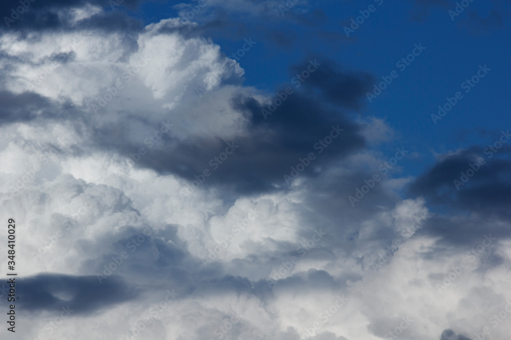 White and dark clouds in the blue sky White and dark clouds in the blue sky