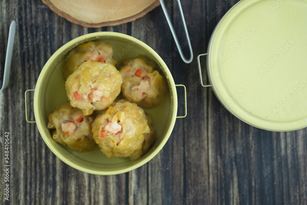 Steamed shrimp dumplings served in tiffin box Steamed shrimp dumplings served in tiffin box