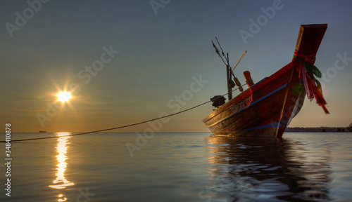 A Boat during Shallow water sunset in Koh Phangan Thailand