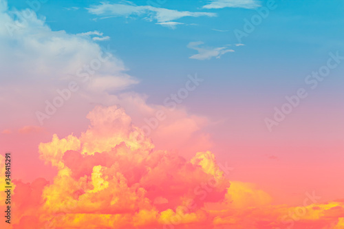 Yellow and red pink color light in clouds with blue sky