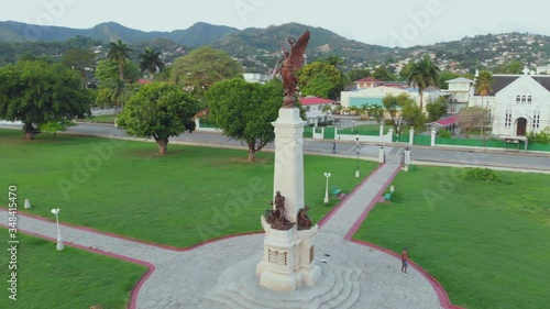 A stately cenotaph of Portland stone and bronze set on four granite steps located in Memorial Park, Trinidad and Tobago photo