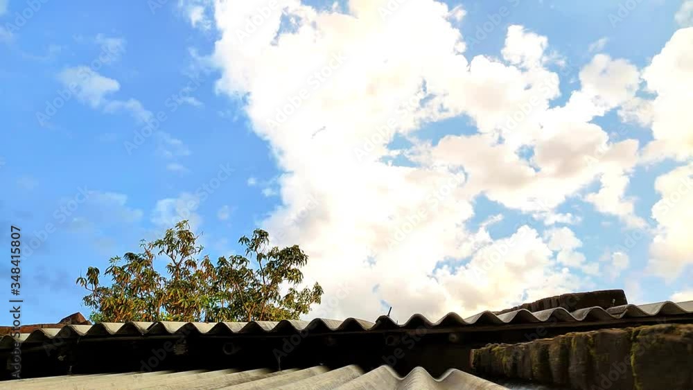 evening cloud timelapse above asbestos shad home at remote village evening cloud timelapse above asbestos shad home at remote village
