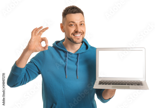 Handsome man with laptop sh...
