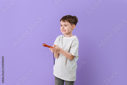 Little boy with flashlight ...