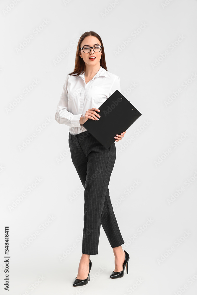 Beautiful young secretary on white background Beautiful young secretary on white background