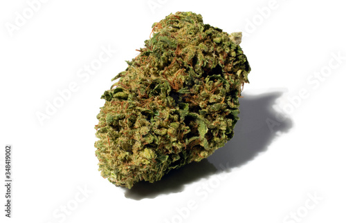  Kosher Kush, an Indica dominant hybrid cannabis bud isolated on white.