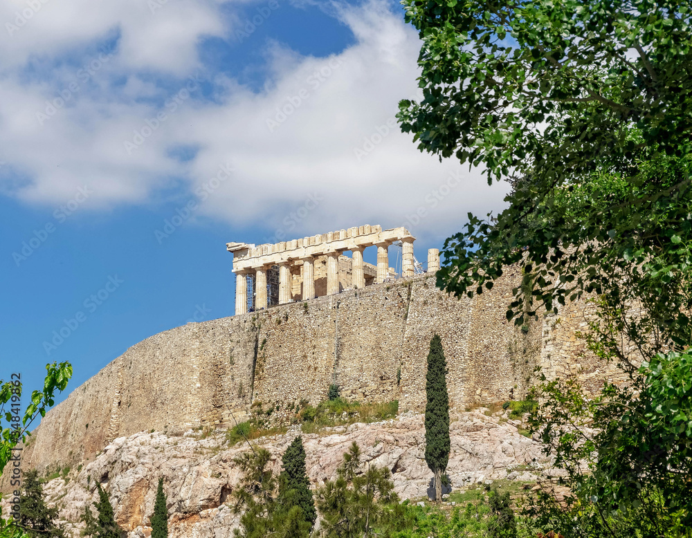 Athens Greece, parthenon temple on acropolis hilll and vibrant greeen foliage
