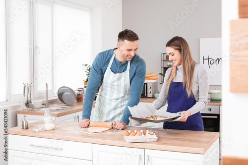 Happy couple preparing cook...