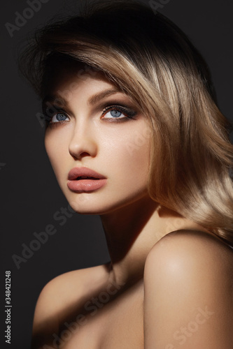 Attractive young model with tan make-up. Gorgeous Woman Face.