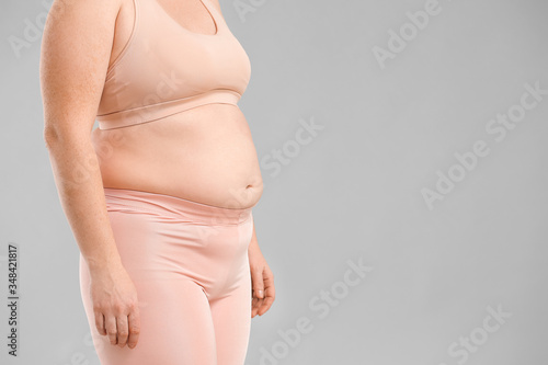 Wallpaper Mural Overweight woman on grey background Torontodigital.ca