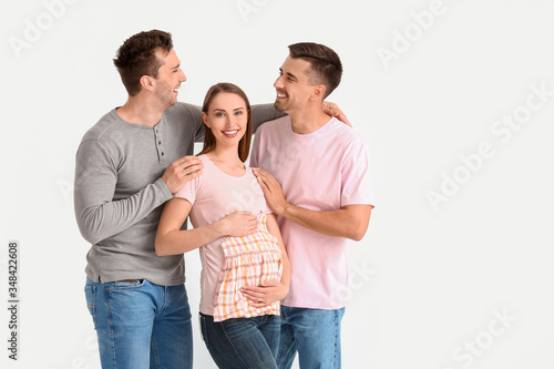 Gay couple with pregnant wo...