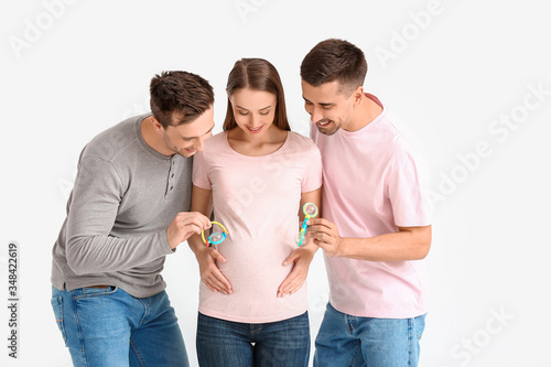 Gay couple with pregnant wo...