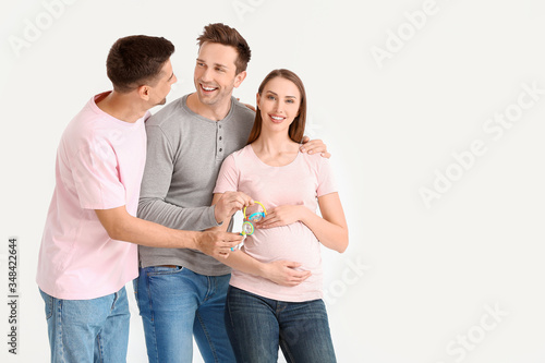 Gay couple with pregnant wo...