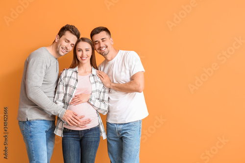 Gay couple with pregnant wo...