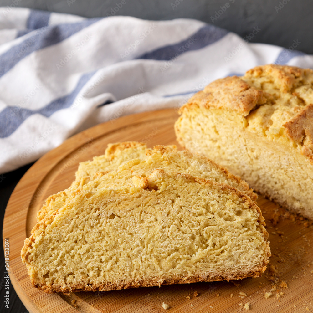 Fototapeta premium Homemade Irish Soda Bread on a black background, side view. Close-up.