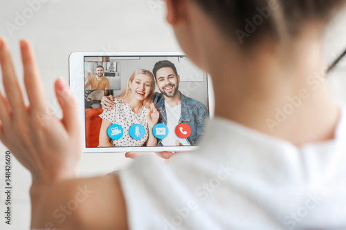 Young woman video chatting ...