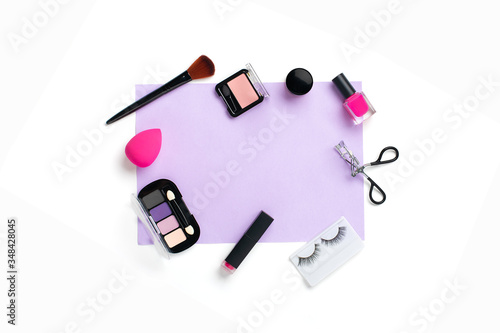 Set of professional decorative cosmetics  makeup tools and accessory of trendy pink color isolated on purple and white background Flat lay Top view