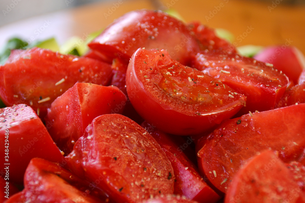 pieces of tomatoes with salt and pepper sprinkled pieces of tomatoes with salt and pepper sprinkled