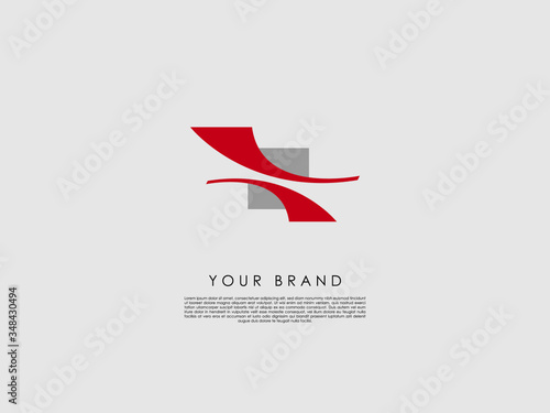 a business logo with a divided grey square and two red arcs